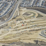 Construction for the Fish Creek Boulevard bridge spanning the SWCRR and connecting to 37 Street (looking east)