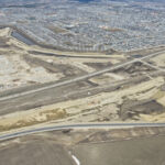 Earthworks for the interchange at Highway 22X and SWCRR, as well as the south gravel site and asphalt plant (looking northeast)