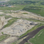 Crushing operations, the south asphalt plant and gravel stockpiles near Highway 22X, with Spruce Meadows in the background (looking southeast)