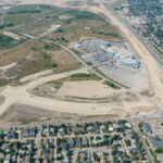 Building the base for Grey Eagle Boulevard adjacent to 37 Street and south of Glenmore Trail (looking west)