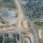 The detour ramp from northbound Grey Eagle Boulevard to eastbound Glenmore Trail, as well as earthworks to build new lanes along Glenmore Trail (looking west)