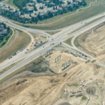 Bridge piers and retaining walls taking shape at 37 Street and 130 Avenue / Buffalo Run Boulevard (looking southeast)