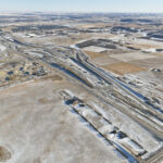 View of the of the south gravel site and intersection of Highway 22X and 37 Street (looking southeast)