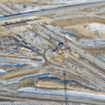 Demolition of the old Highway 22X bridge spanning Macleod Trail and placing girders on the new bridge from eastbound Highway 22X to northbound Macleod Trail (looking northeast)