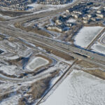 View of the bridges spanning the Canadian Pacific Railway line, as well as the intersection of Highway 22X and 6 Street / Sheriff King Street (looking northwest)
