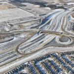 View of the detour around the new bridge at Fish Creek Boulevard - much of the detour is built on what will be the future interchange ramps (looking northwest)