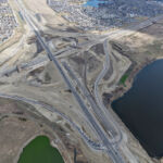 Eastbound and westbound traffic realigned onto the future westbound SWCRR at Macleod Trail, with the old portion of Highway 22X being milled out (looking southeast)