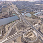 Bridges under construction at Macleod Trail, with the Highway 22X corridor in the background (looking northwest)