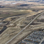 Earthworks underway to build new road in the median of Highway 22X in preparation for a significant traffic realignment later this year (looking southwest)